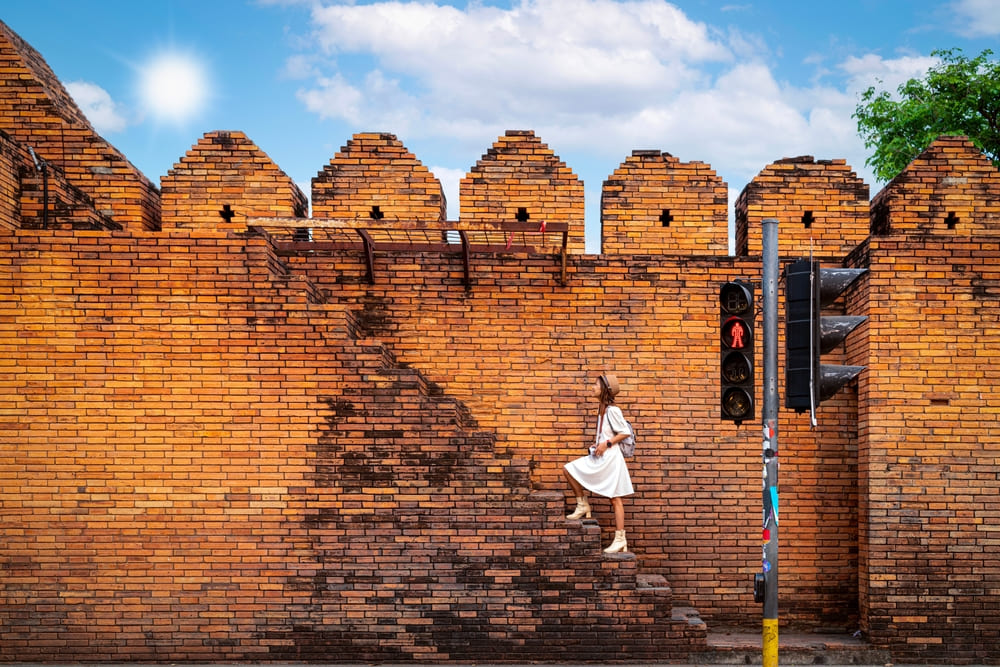 Tourist Walking on a Wall of Tha Phae Gate  in Chiang Mai city