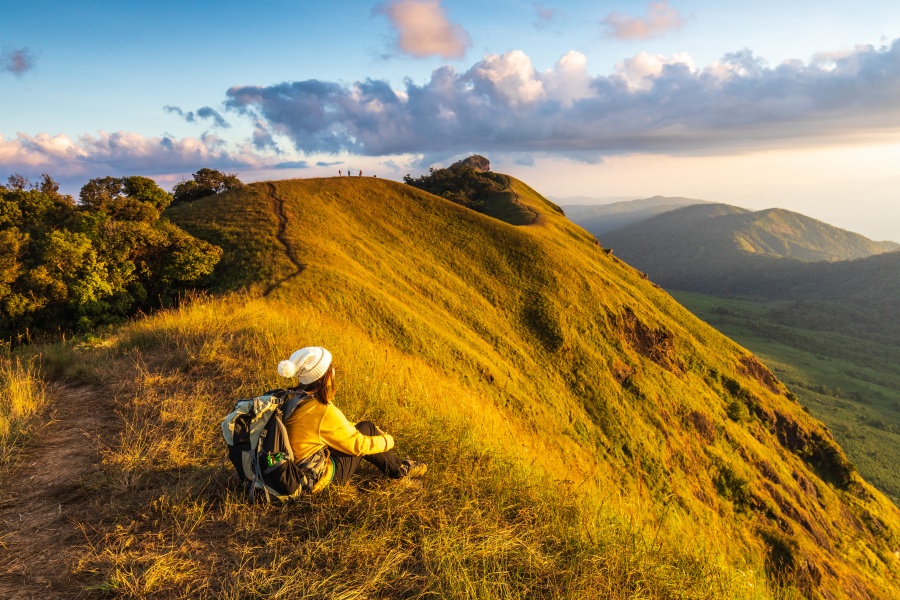 Young  woman hiking on mountains. Doi Mon Chong, Chiangmai, Thailand.