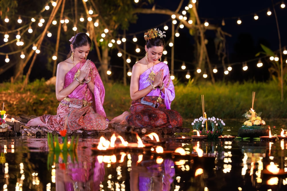 Women make a wish on Loy Krathong Festival, Thailand 