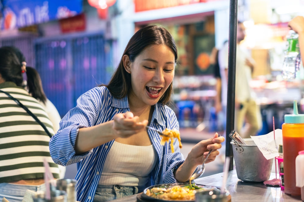 Woman eating street food