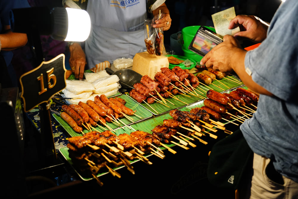 Meat skewers on banana leaves