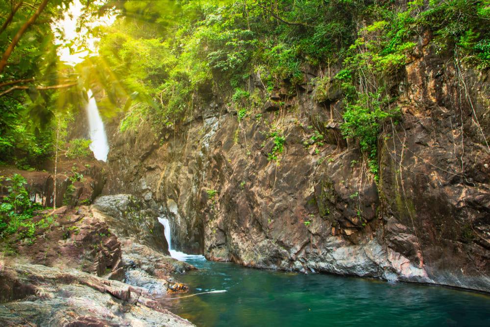 Sun shining through Klong Plu Waterfall, Trat
