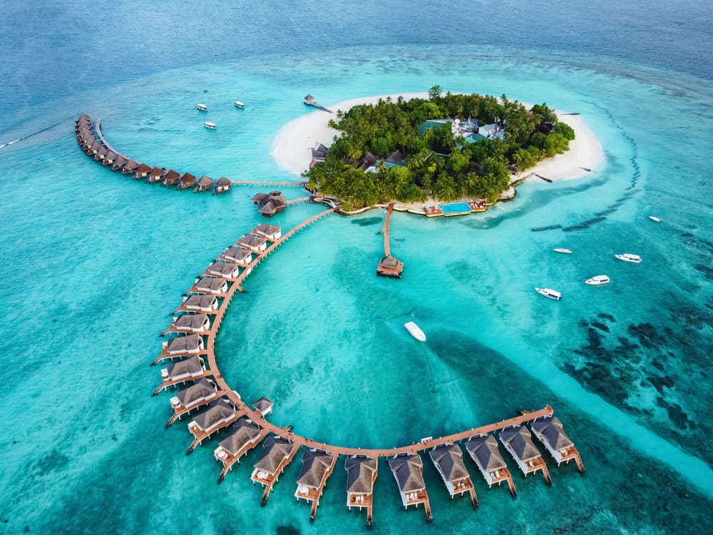 Top view of beautiful resorts with overwater villas in the Maldives 