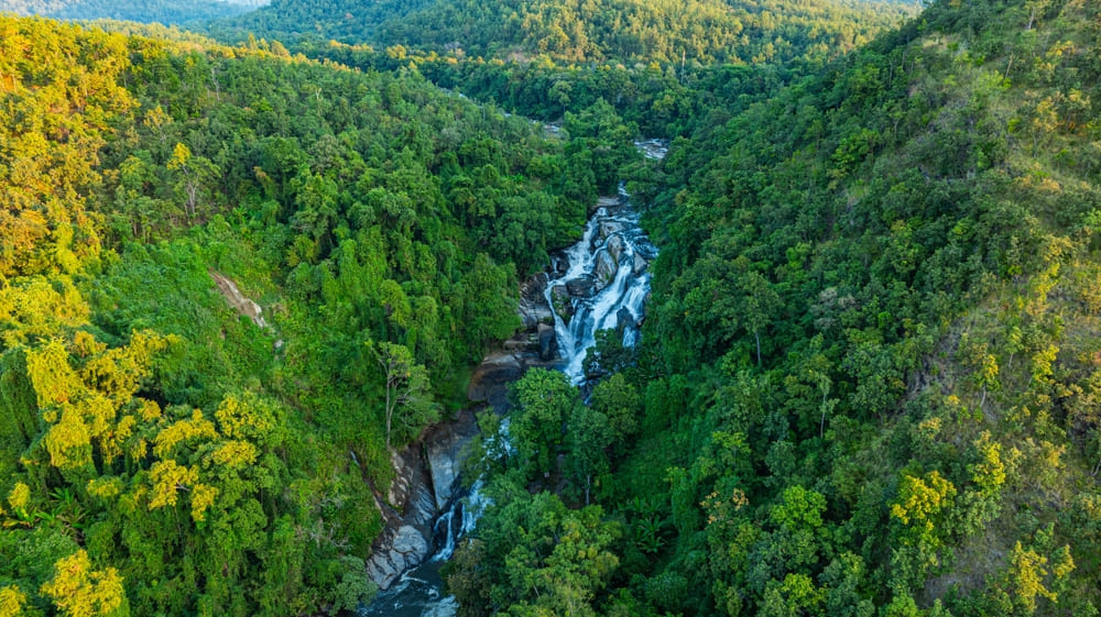 Mae Klang Waterfall streaming through the forest in Doi Inthanon