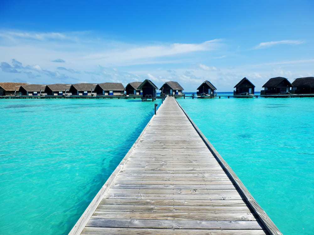Wooden path leading to overwater bungalows in Cocoa, Maldives Island