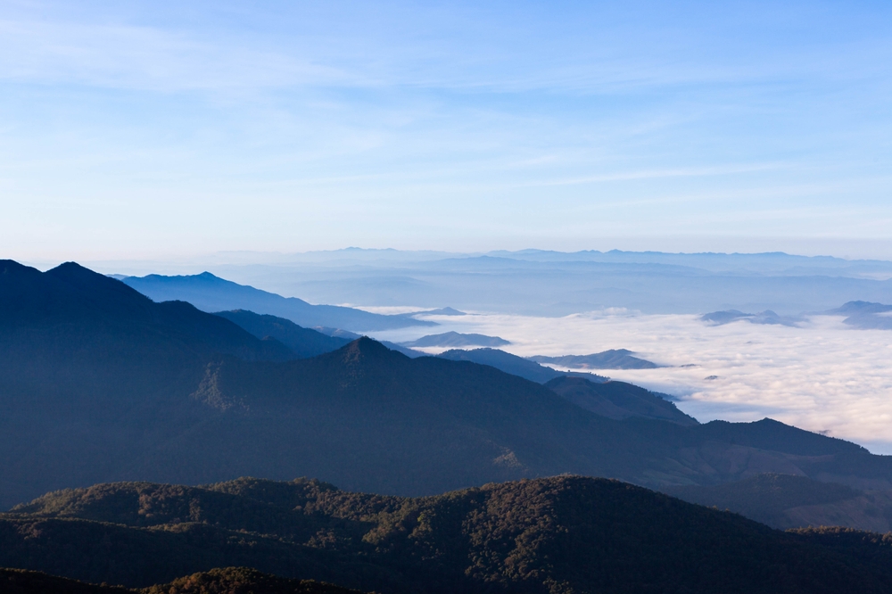 Sea of clouds and view of mountain range at the summit of Doi Inthanon
