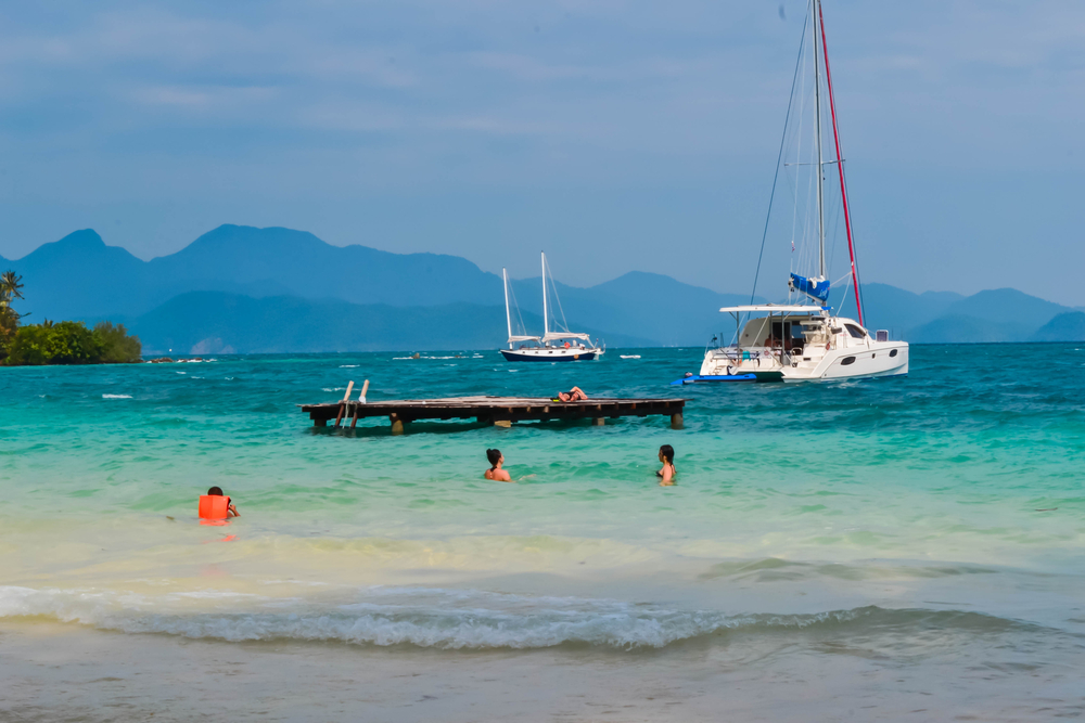 Tourists snorkeling in the northern bay of Koh Wai island, Trat, Thailand