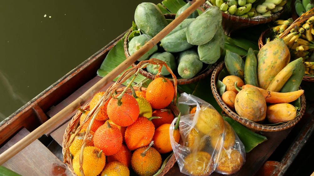 Fruits on sale on a boat floating on a canal
