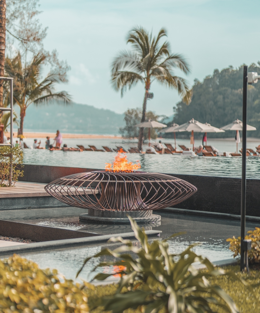 Fire near the pool next to the beach at Layan Anantara in Phuket, Thailand
