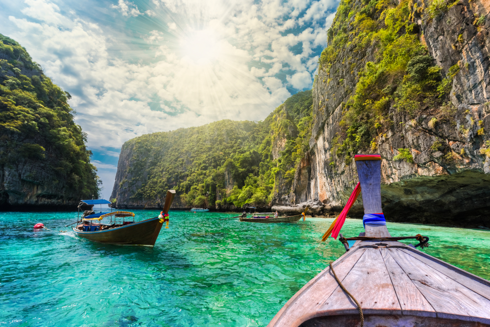 Longtail boats sailing in Loh Samah Bay in Krabi, Thailand