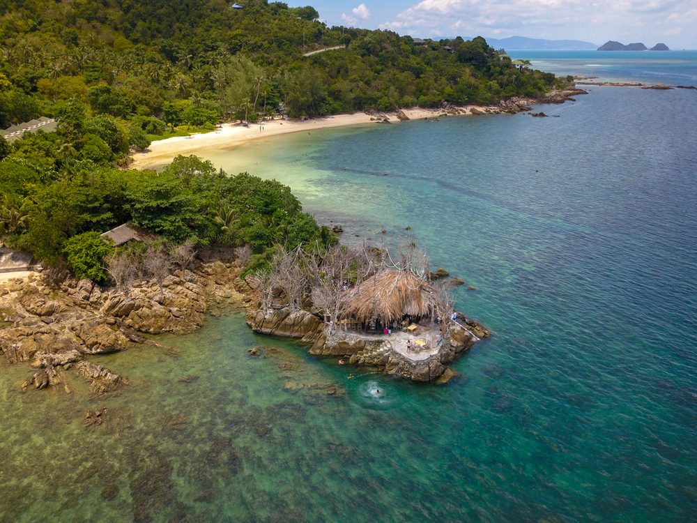 Turquoise seawater with green jungle on the island at Koh Raham