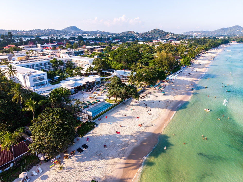 Beach club at Chaweng Beach, Koh Samui with long stretch of white