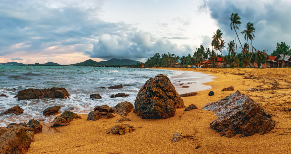 Beautiful seascape with rocks in the sand at Maenam Beach, Koh Samui