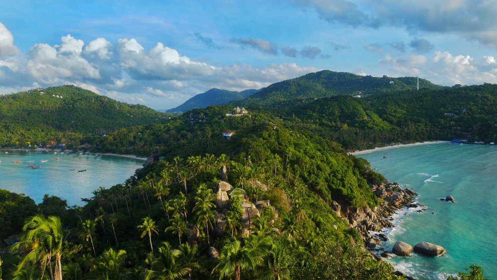 Lush vegetation covers the island and mountains with two bays on both sides at John-Suwan Viewpoint in Koh Tao