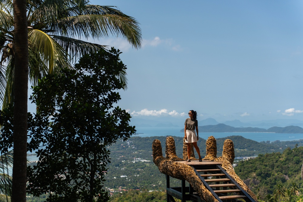 A woman enjoying the stunning scenery from the viewpoint of Overlap Stone 2, Koh Samui.