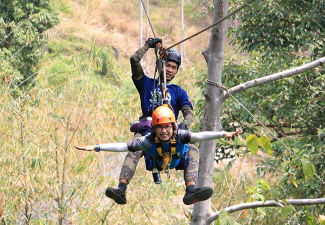 Woman standing on a canopy walkway