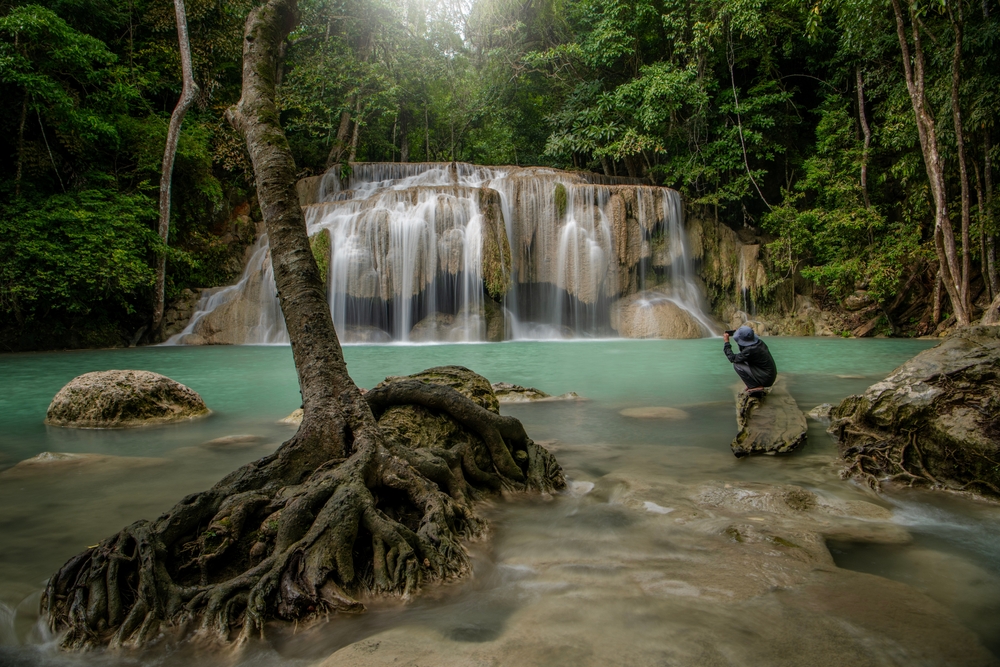 Erawan Waterfall in Kanchanaburi, a famous waterfall in Thailand known for its stunning turquoise-blue water and limestone tiers.