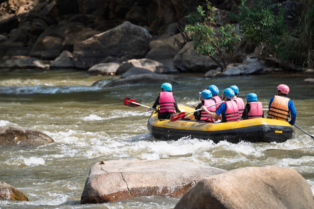 Tourists paddle on a white-water river in Mae Taeng, Chiang Mai