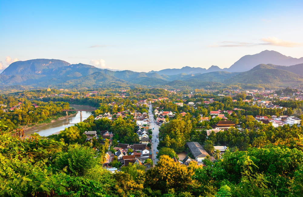 A panoramic view of Luang Prabang and the Mekong River during the rainy season in Southeast Asia.