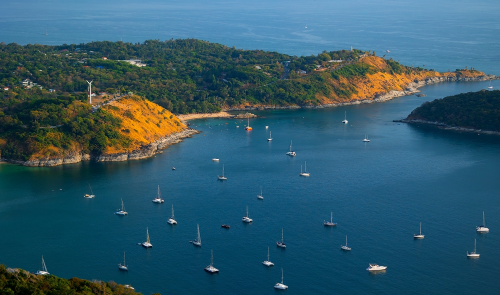 An aerial view of boats in a scenic bay in Phuket.