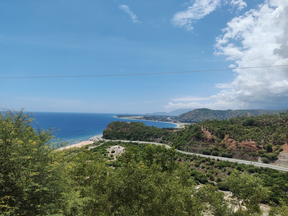 Scenic coastal views of Dili Bay in Timor-Leste during the rainy season in Southeast Asia.