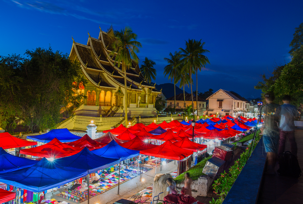 Colorful stalls at the Luang Prabang Night Market offering Lao street food and handmade souvenirs.