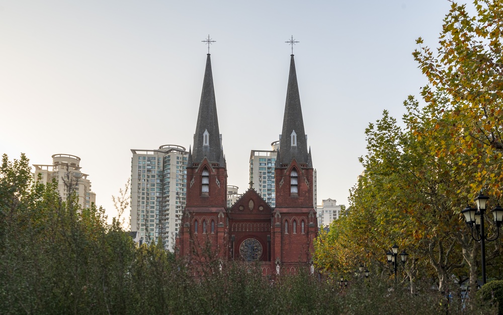  A historic red-brick church blending with autumn trees in the Former French Concession, Shanghai.