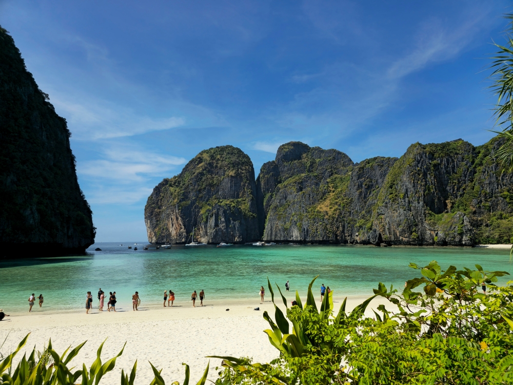 The world-famous Maya Bay with towering limestone cliffs, a must-visit destination from Ao Nang Beach in Krabi, Thailand.
