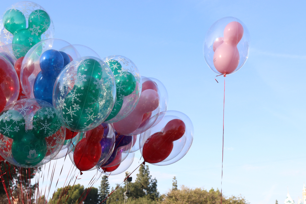 Colorful Mickey Mouse-shaped balloons floating in the sky