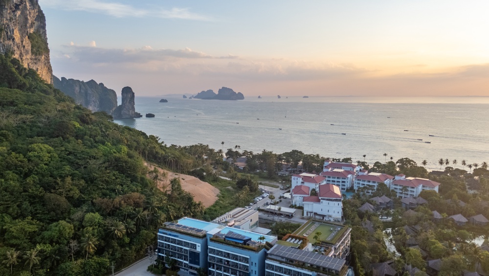Aerial view of beachfront resorts and the beautiful coastline near Ao Nang Beach in Krabi, Thailand.